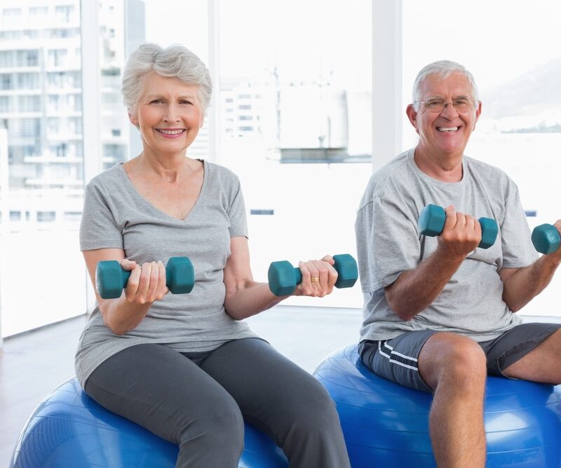 seniors-lifting-weights-exercise-ball